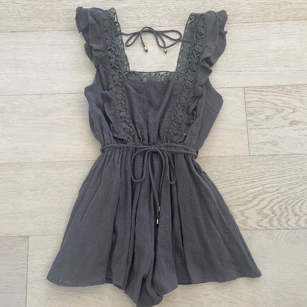 Olivaceous Dark Grey Linen Ruffle Shoulder Open Back Romper